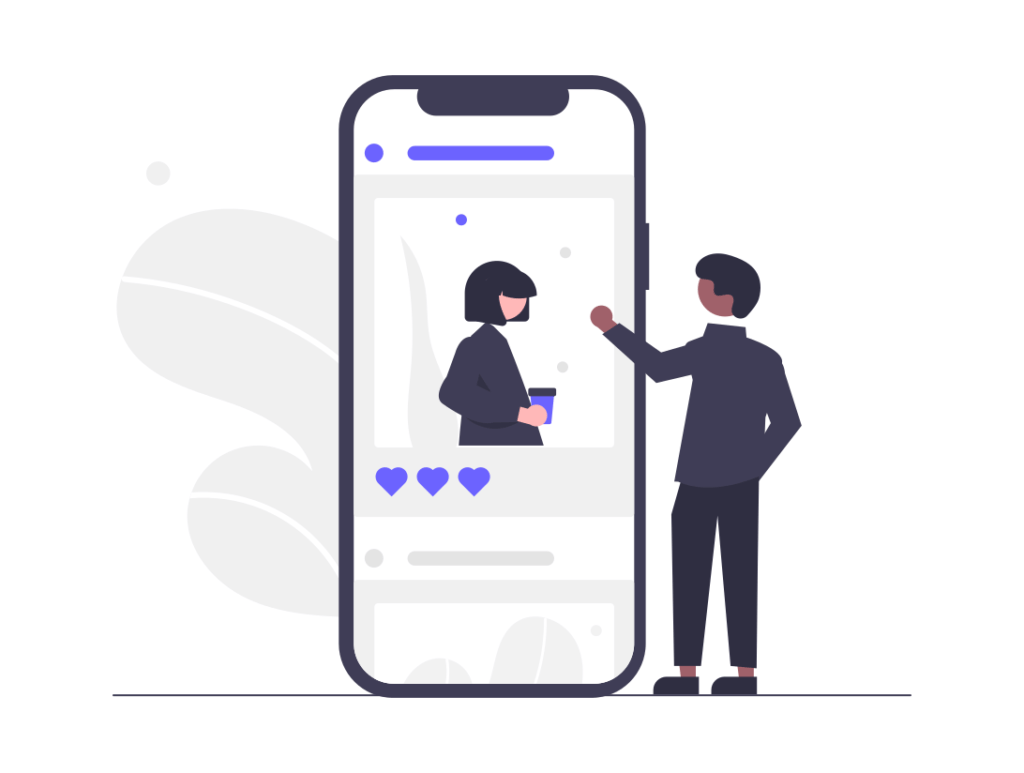 A man from a marketing agency is pointing at a woman's phone screen.